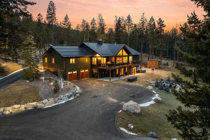 Private hot tub and deck at dusk at The Tamarack
